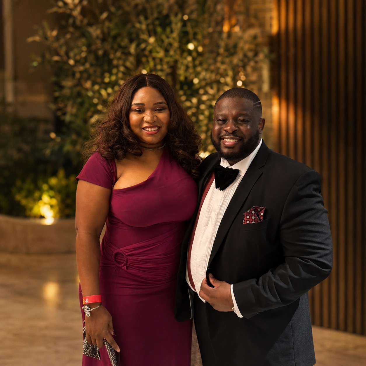 Christabel and Abiola dressed for a Christmas celebration
