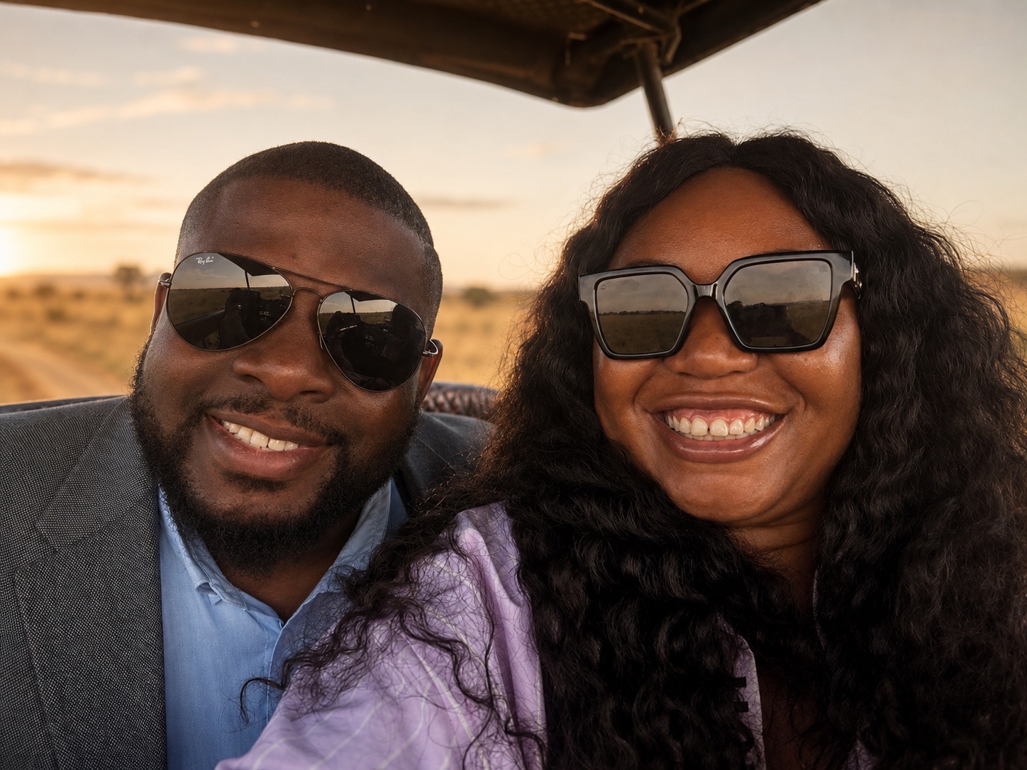 Christabel and Abiola smiling during a safari